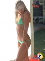 Skinny Alluring Vixen Lena Nicole poses in a tiny string bikini